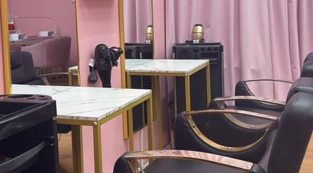 Modern salon chairs and marble tables at Aurora Beauty Women Salon in Dubai, AE.
