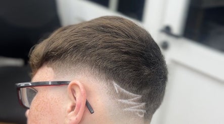 Modern hairstyle with geometric design at clell_cutz, Crossgates, Scotland, GB.