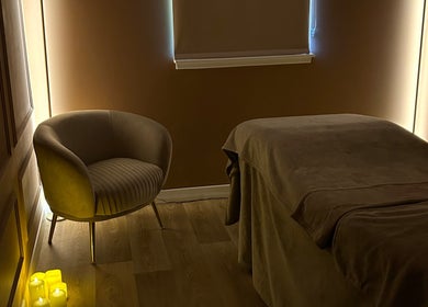Relaxing treatment room at RS Skincare, Cumbernauld, Scotland, GB with soft lighting and soothing decor.