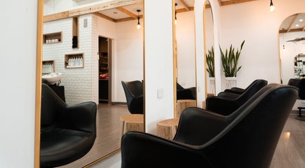 Stylish seating area at Linea Of The Yarra Valley in Lilydale, Victoria, AU with modern decor and lush greenery.