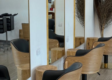 Elegant salon chairs against mirrors at Linea Of The Yarra Valley, Lilydale, Victoria, AU.