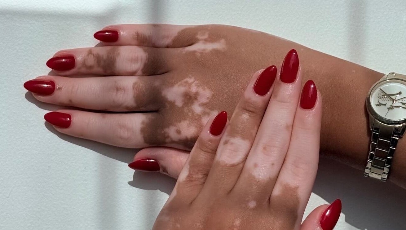 Red manicured hands at Fatima Beauty House, Aqaba, Aqaba Governorate, JO, showcasing elegant nail art.