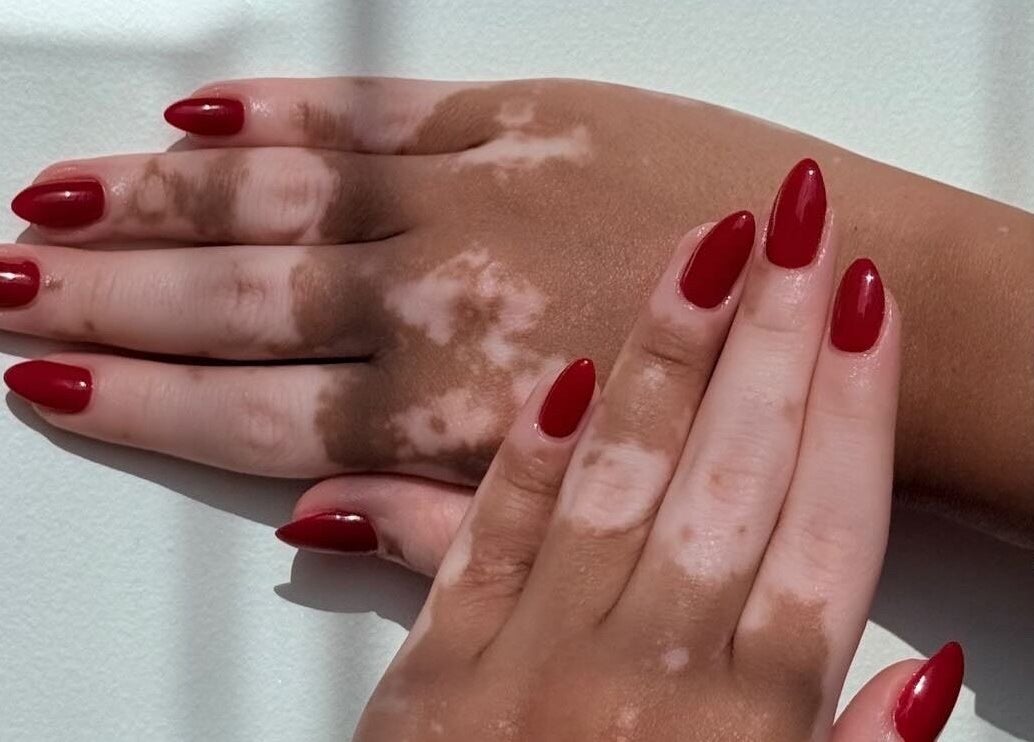 Red manicured hands at Fatima Beauty House, Aqaba, Aqaba Governorate, JO, showcasing elegant nail art.