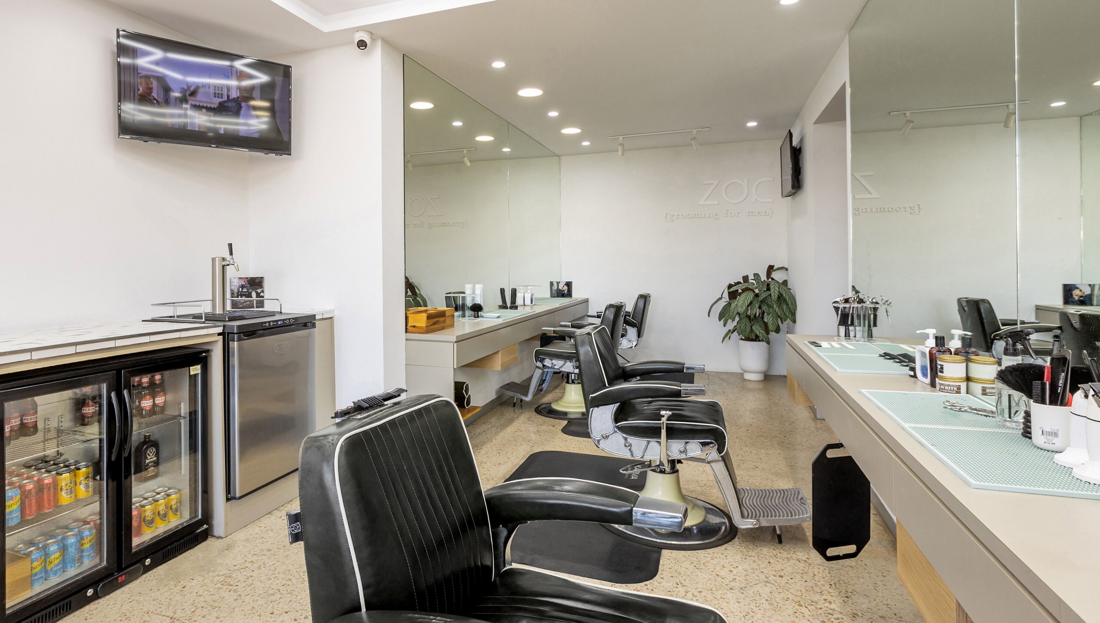 Modern barber chairs inside Zac Grooming for Men in Glenelg South, South Australia, AU.