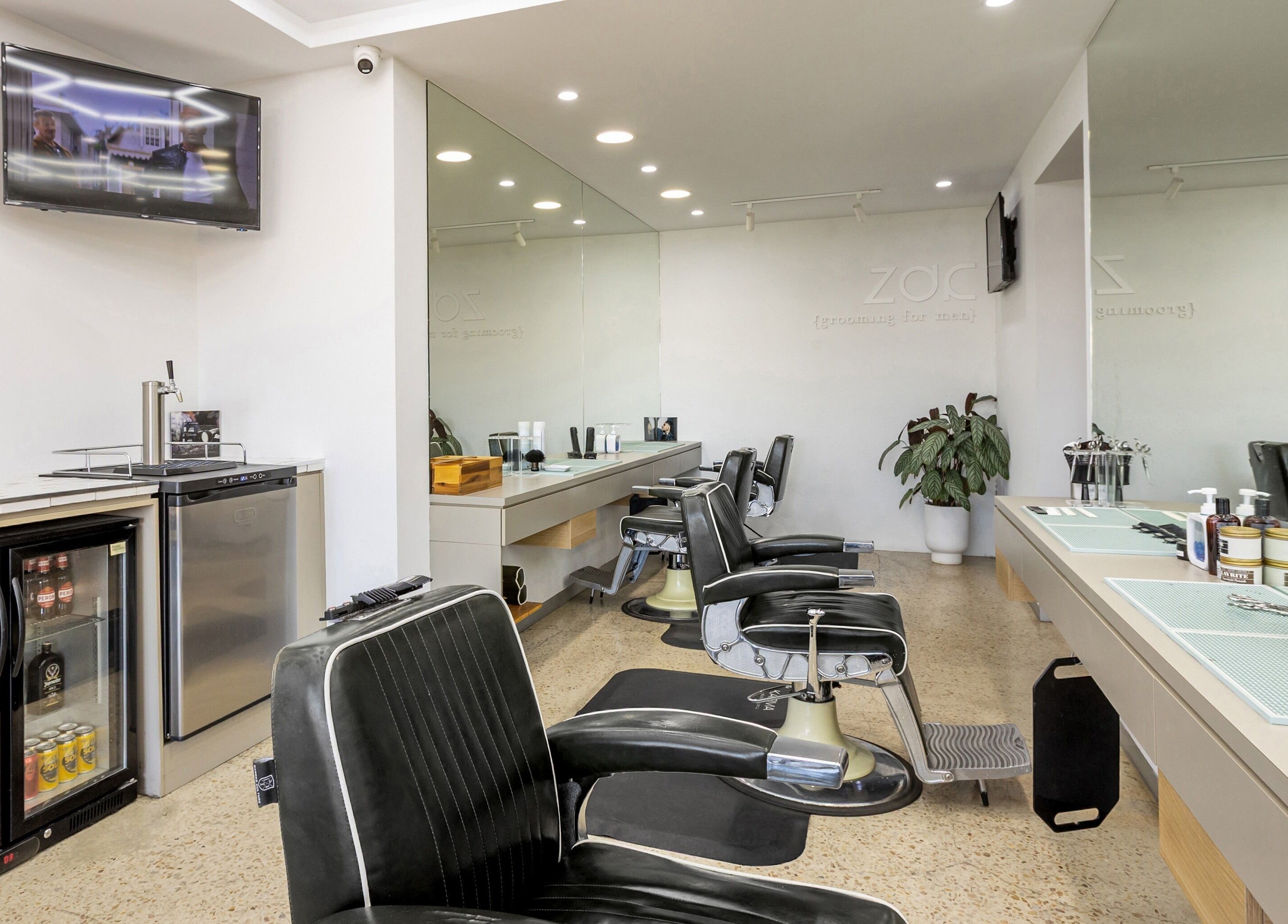 Modern barber chairs inside Zac Grooming for Men in Glenelg South, South Australia, AU.