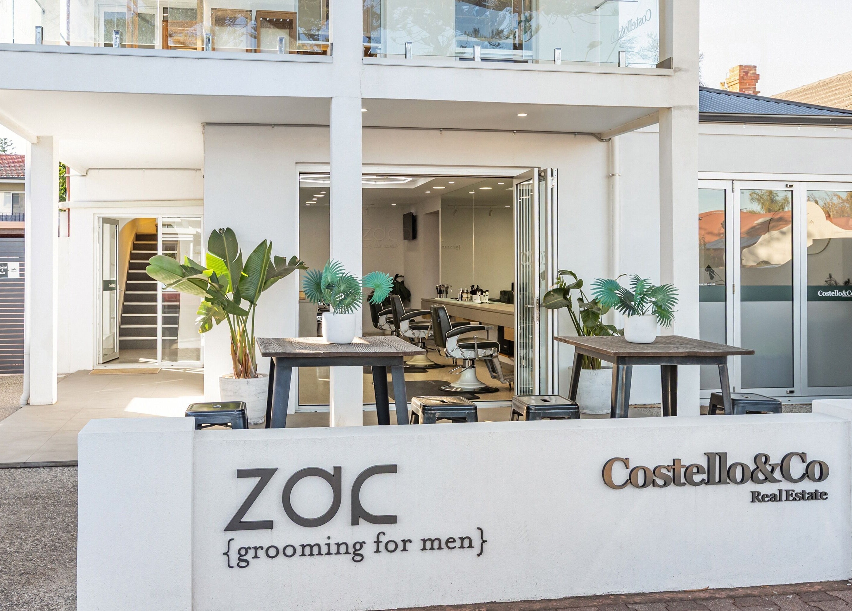 Front view of Zac Grooming for Men in Glenelg South, South Australia, AU featuring modern design and greenery.