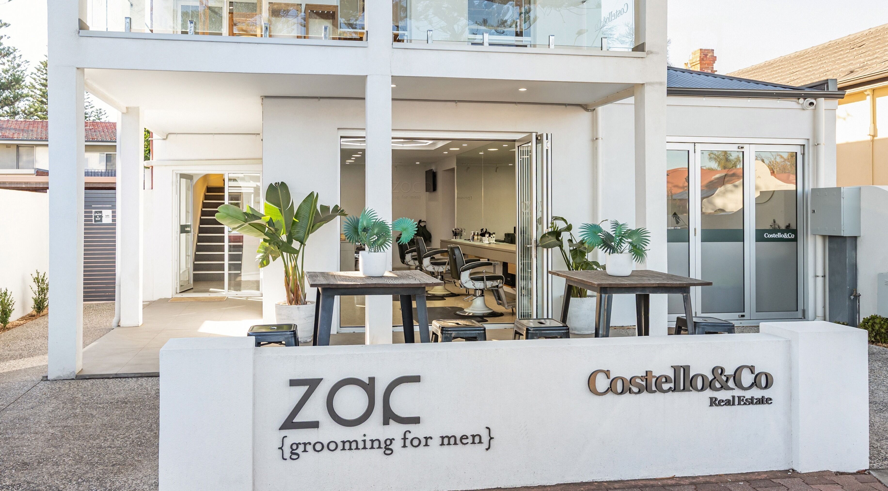 Front view of Zac Grooming for Men in Glenelg South, South Australia, AU featuring modern design and greenery.