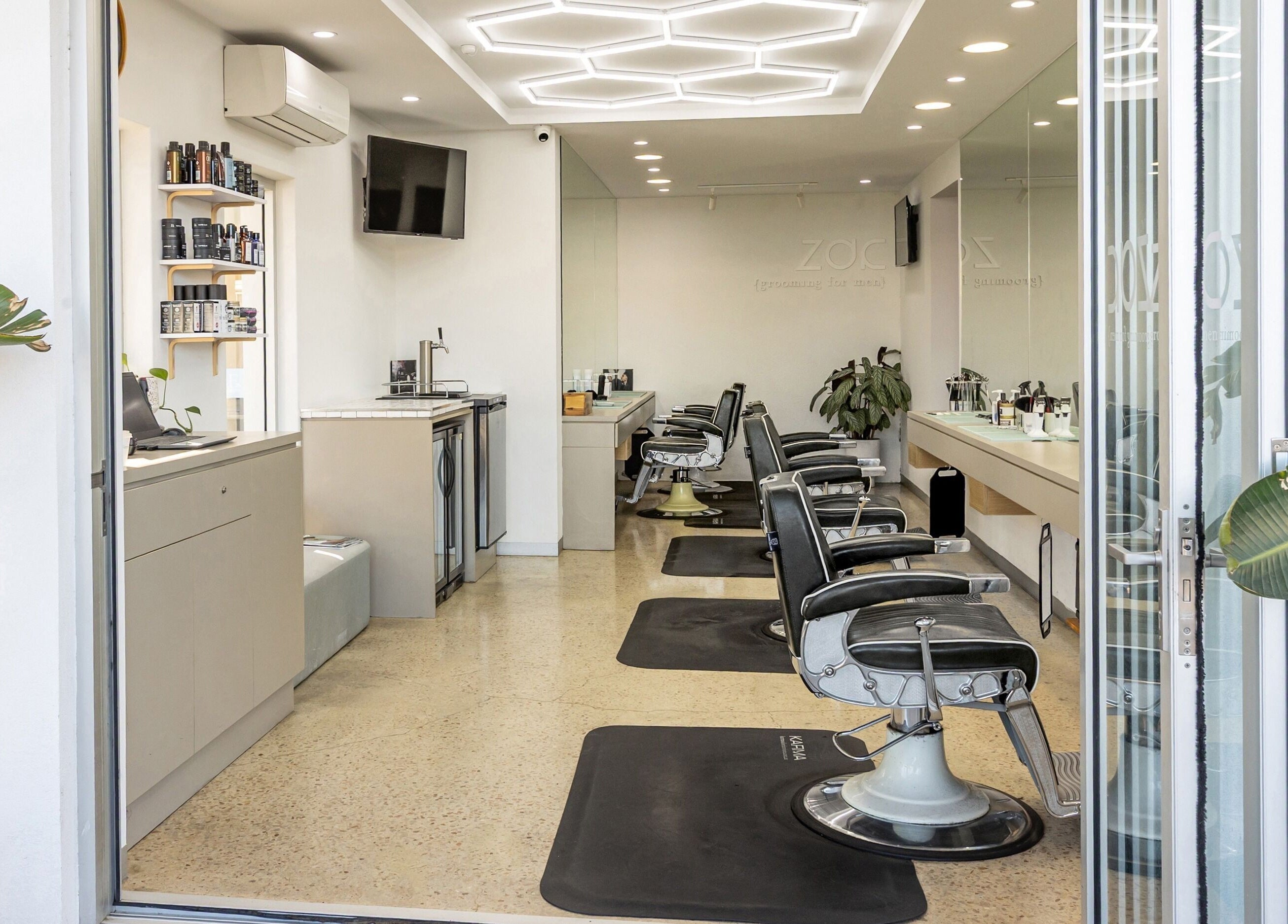 Interior of Zac Grooming for Men in Glenelg South, South Australia, AU. Sleek barber chairs and stylish decor.