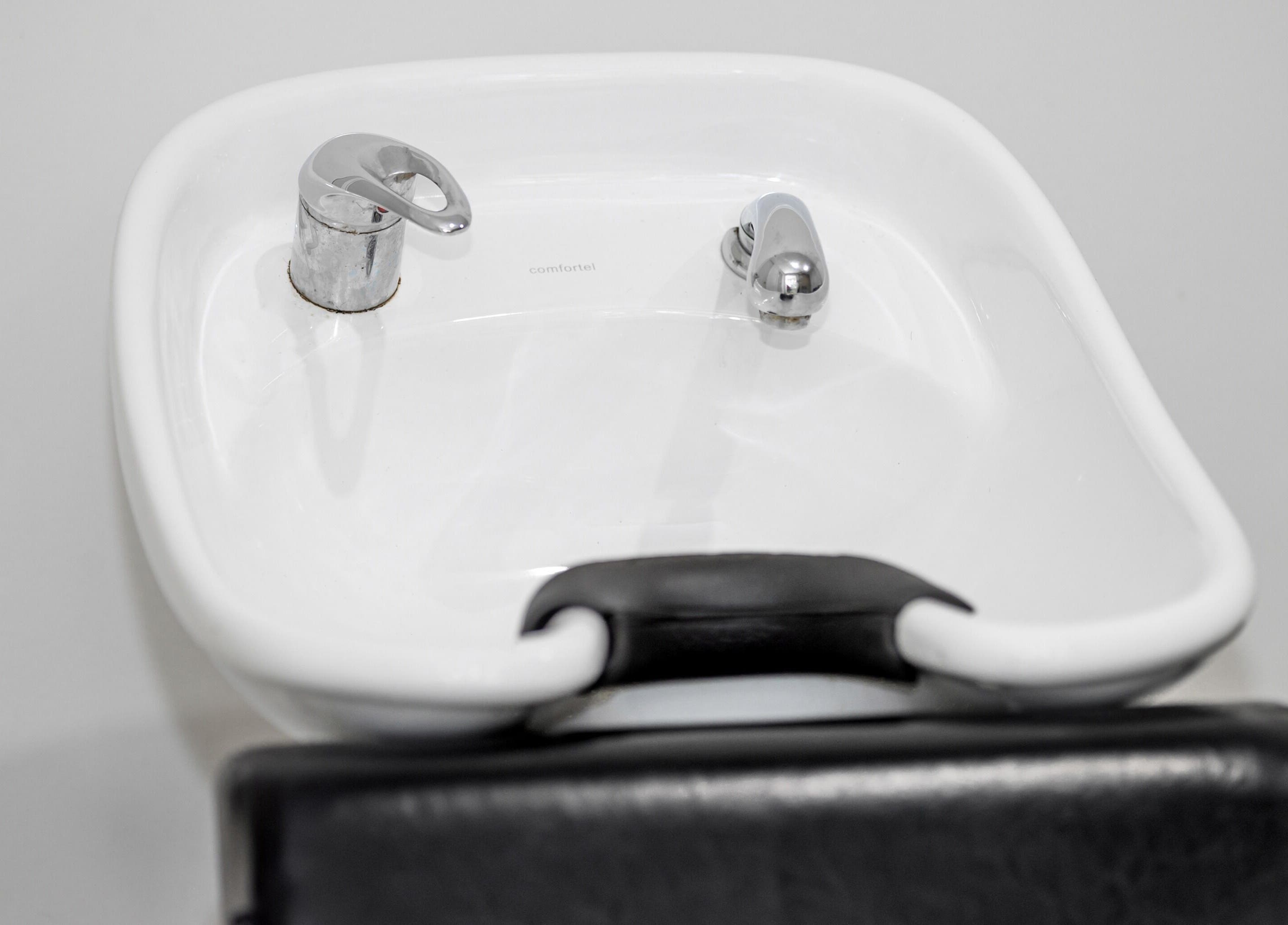 Modern wash basin at Zac Grooming for Men in Glenelg South, South Australia, AU offering superior styling services.