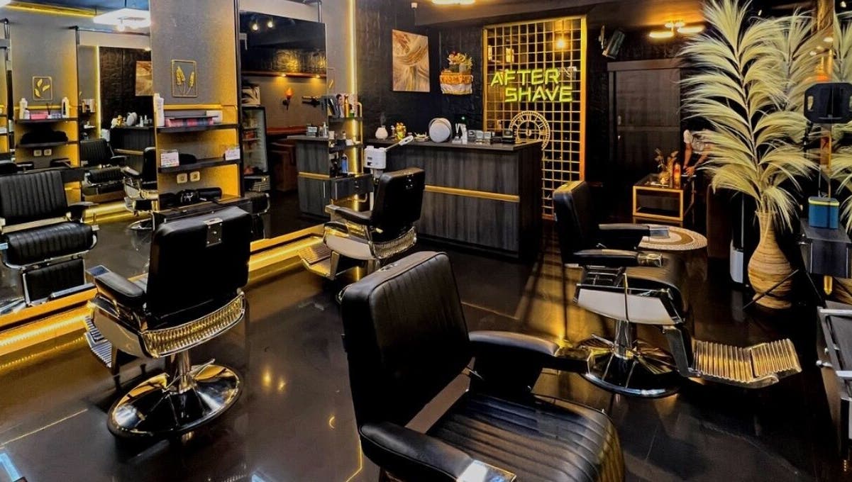 Modern interior of AFTERSHAVE BARBERSHOP, Bali, Bali, ID showcasing stylish chairs and sleek decor.
