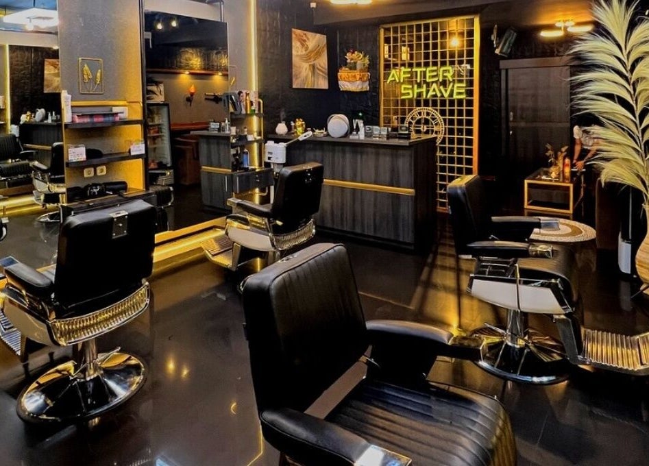 Modern interior of AFTERSHAVE BARBERSHOP, Bali, Bali, ID showcasing stylish chairs and sleek decor.