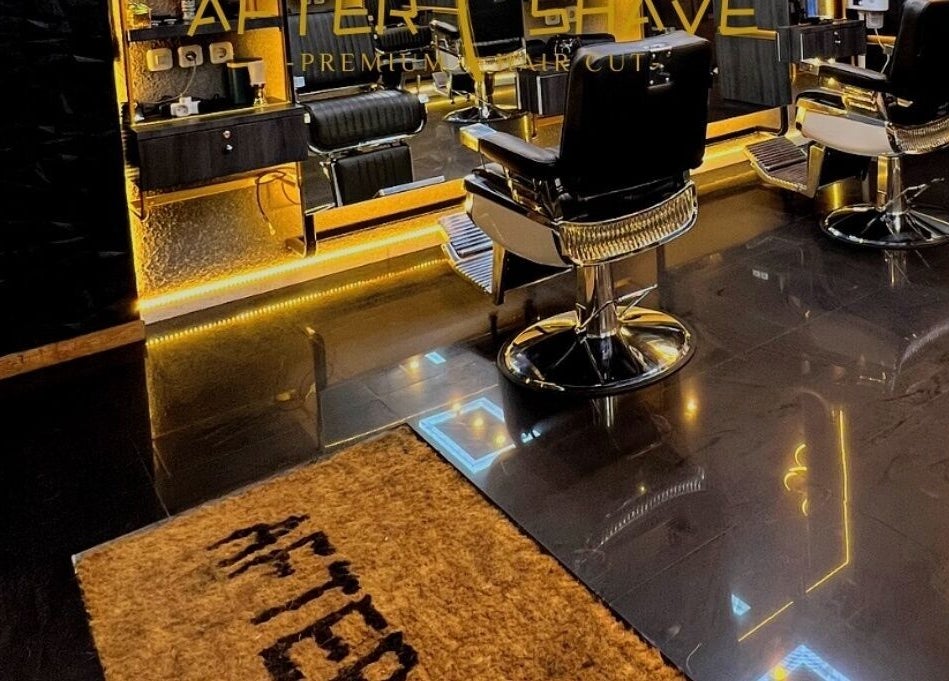 Interior of AFTERSHAVE BARBERSHOP in Bali, Bali, ID featuring sleek barber chairs and modern décor.