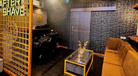 Chic interior of AFTERSHAVE BARBERSHOP in Bali, Bali, ID with stylish seating and textured walls.