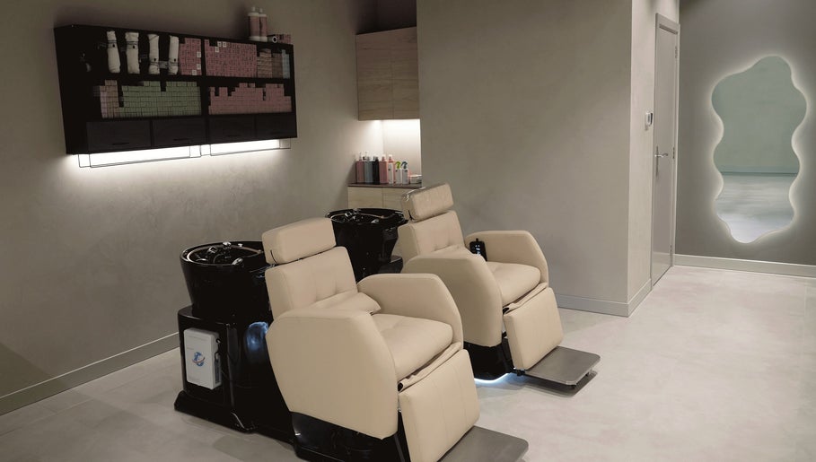 Elegant hair washing stations at Crowns & Petals Beauty Salon, Dubai, AE offer comfort and style.