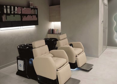 Elegant hair washing stations at Crowns & Petals Beauty Salon, Dubai, AE offer comfort and style.
