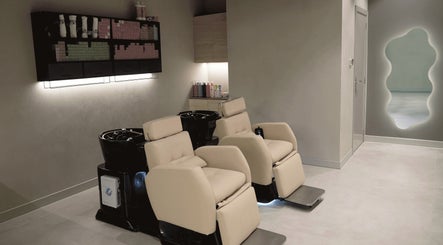 Elegant hair washing stations at Crowns & Petals Beauty Salon, Dubai, AE offer comfort and style.