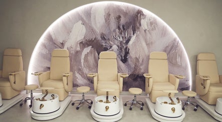 Elegant pedicure chairs at Crowns & Petals Beauty Salon, Dubai, AE, showcasing a serene ambiance with modern decor.