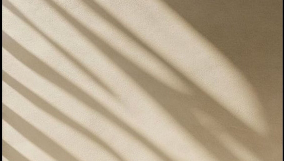 Soft shadows on a beige wall at Ziba Beauty.Spa in Las Vegas, Nevada, US, creating a calming ambiance.
