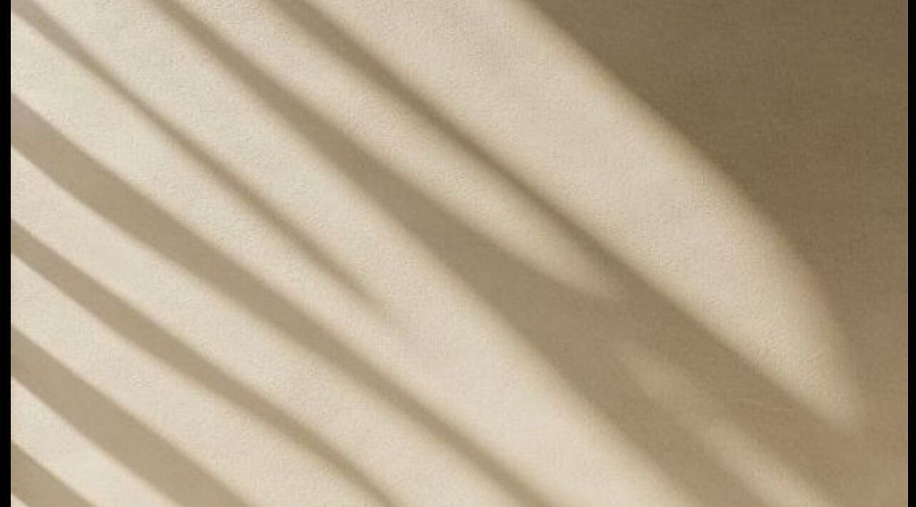 Soft shadows on a beige wall at Ziba Beauty.Spa in Las Vegas, Nevada, US, creating a calming ambiance.