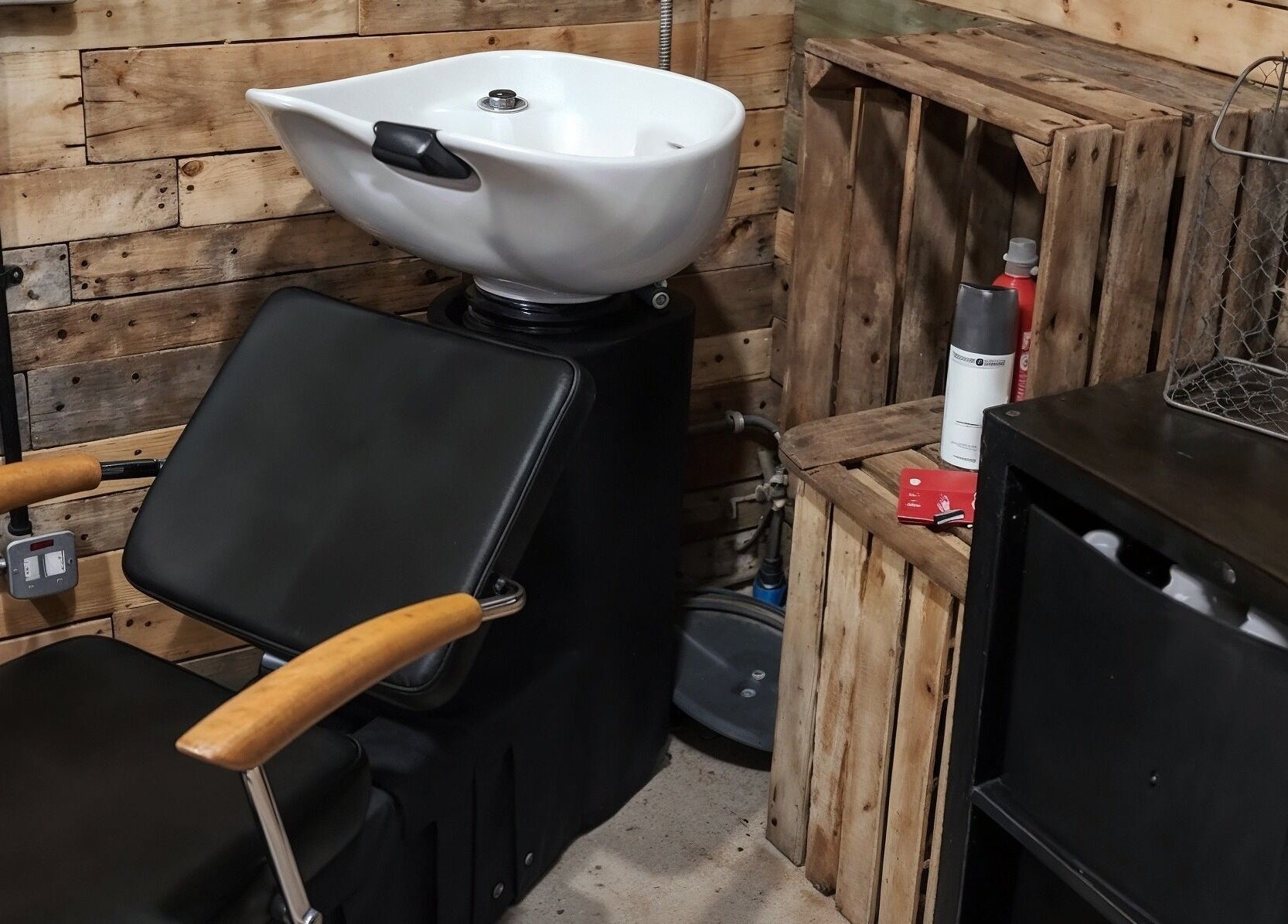 Stylish wash station at The Cabin in Codicote, England, GB with wooden accents and modern sink.