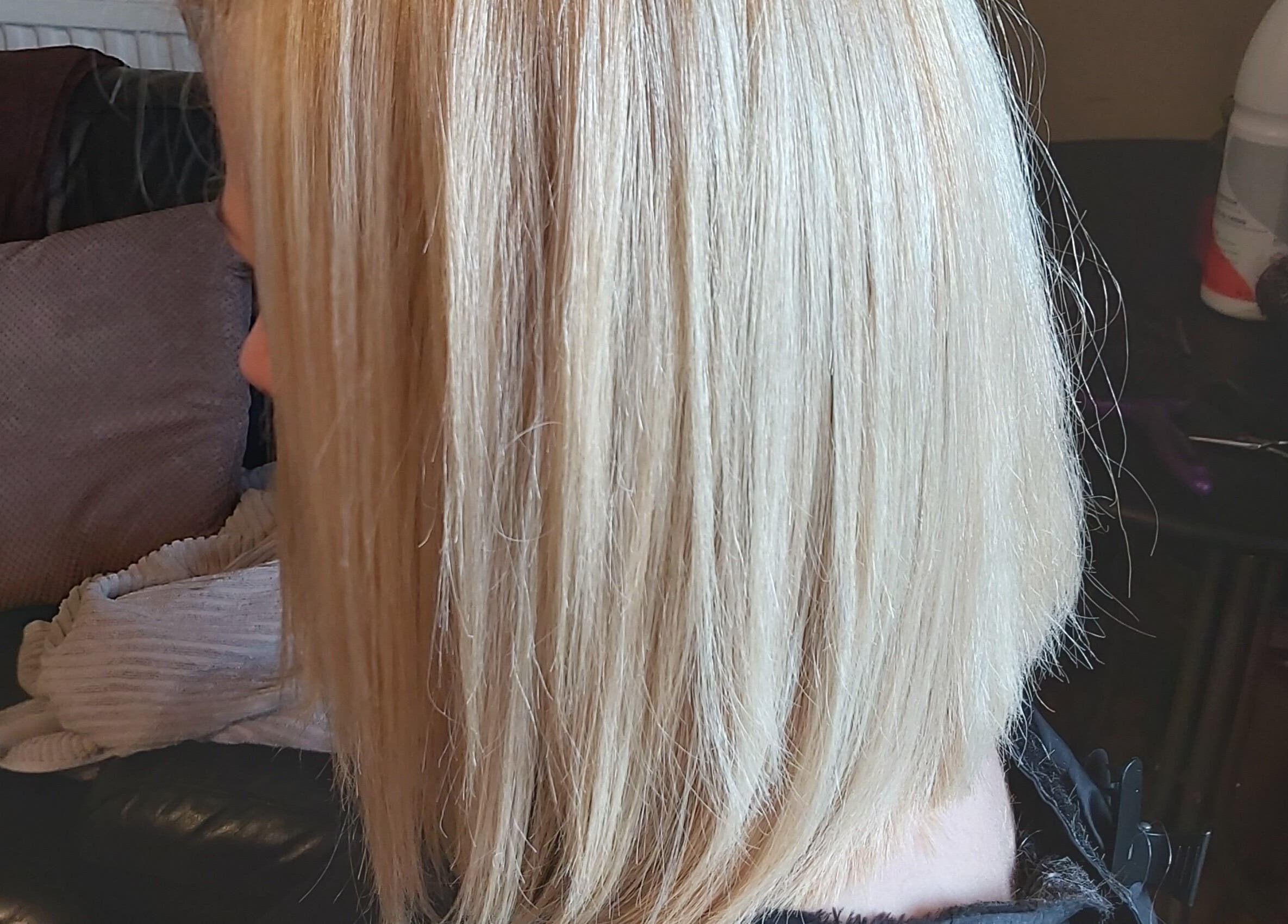 Sleek blonde bob hairstyle at The Cabin, Codicote, England, GB known for chic hair services.