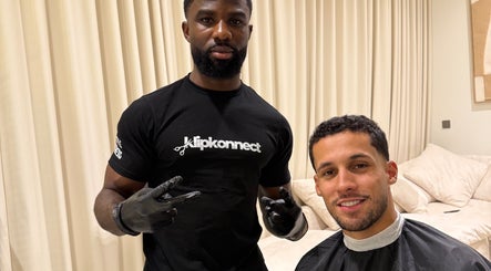 Barber at Klipkonnect in Dubai, Dubai, AE, giving a stylish haircut to a customer.