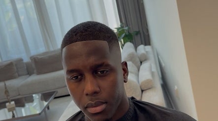 Modern haircut at Klipkonnect, Dubai, Dubai, AE featuring a sleek fade style.