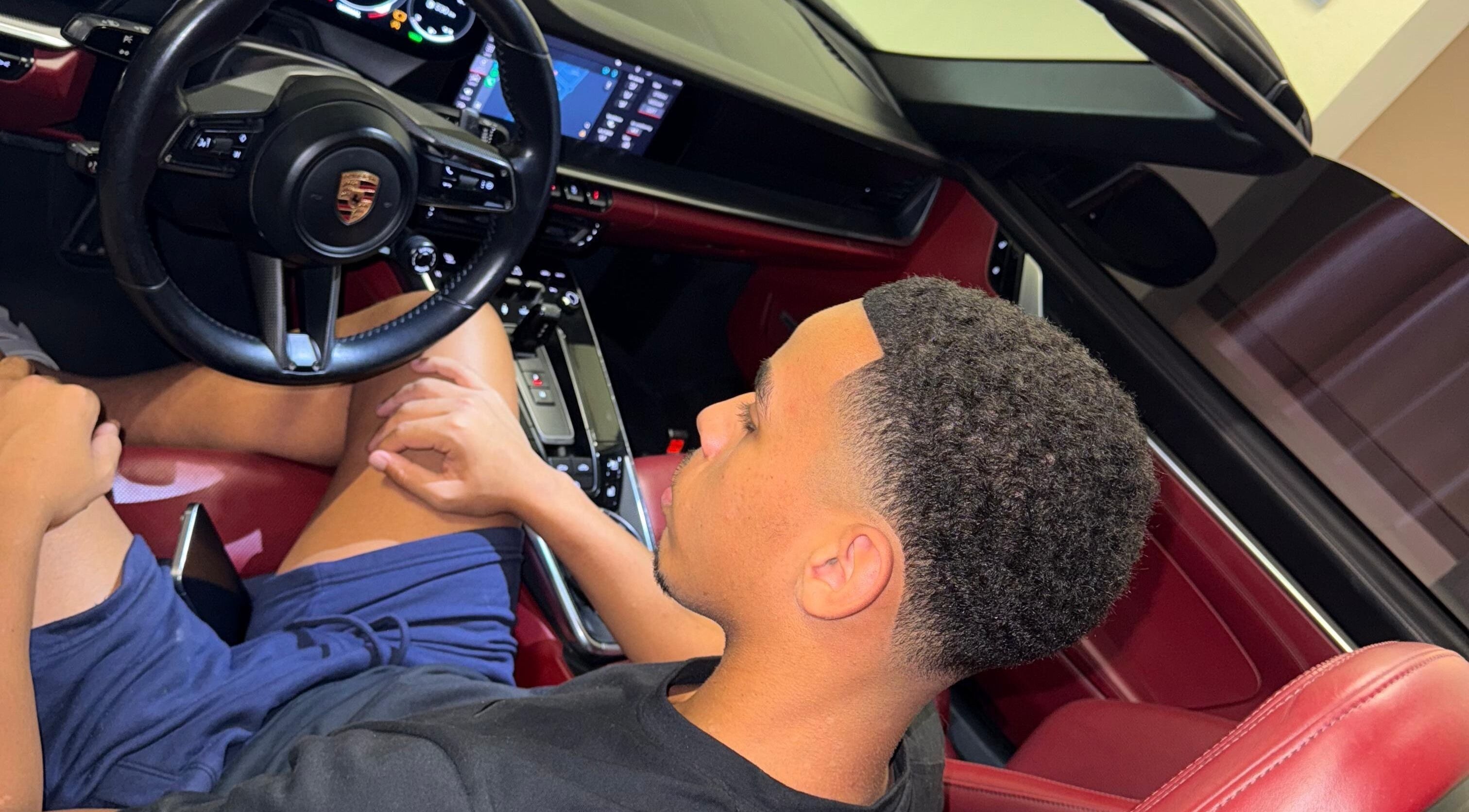 Man sitting in luxury car showcasing style at Klipkonnect, Dubai, Dubai, AE.