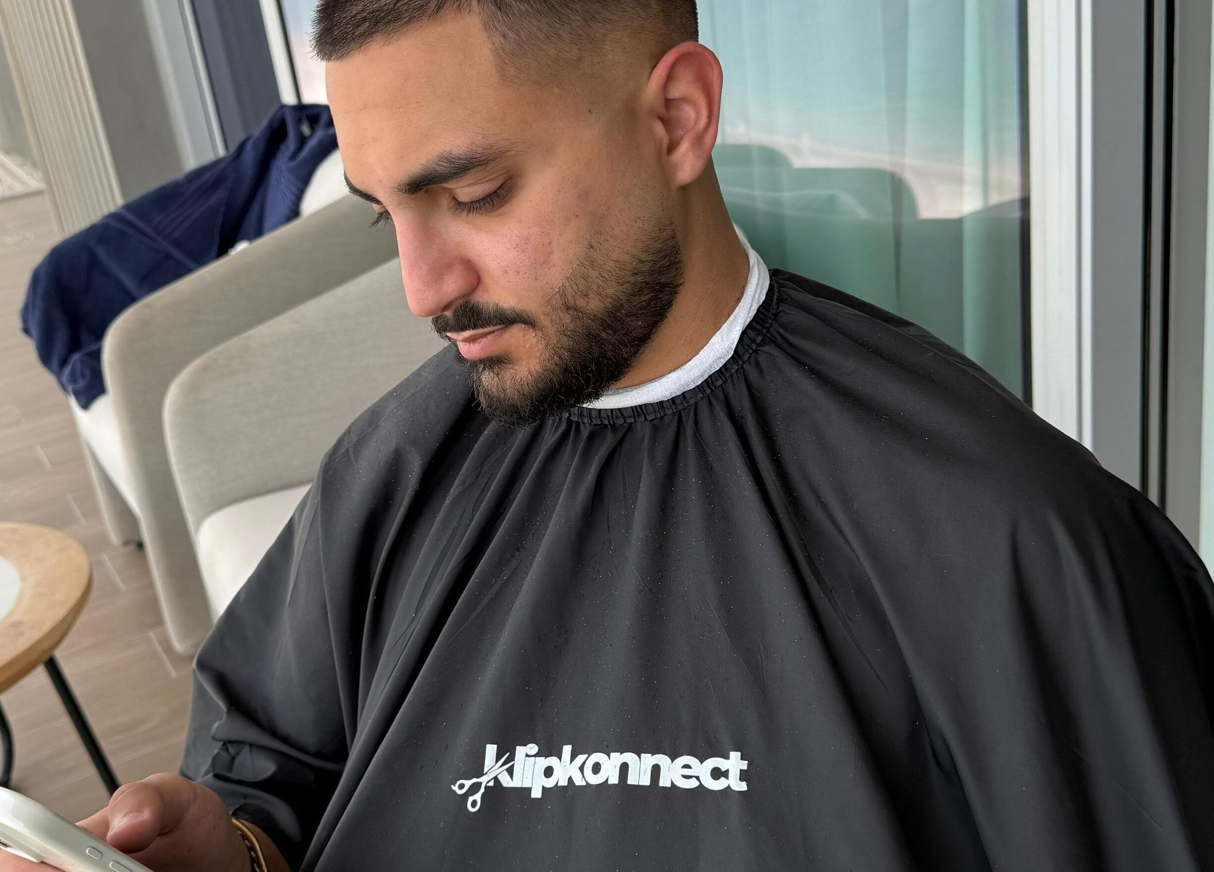 Client at Klipkonnect, Dubai, Dubai, AE, enjoying a stylish grooming session.
