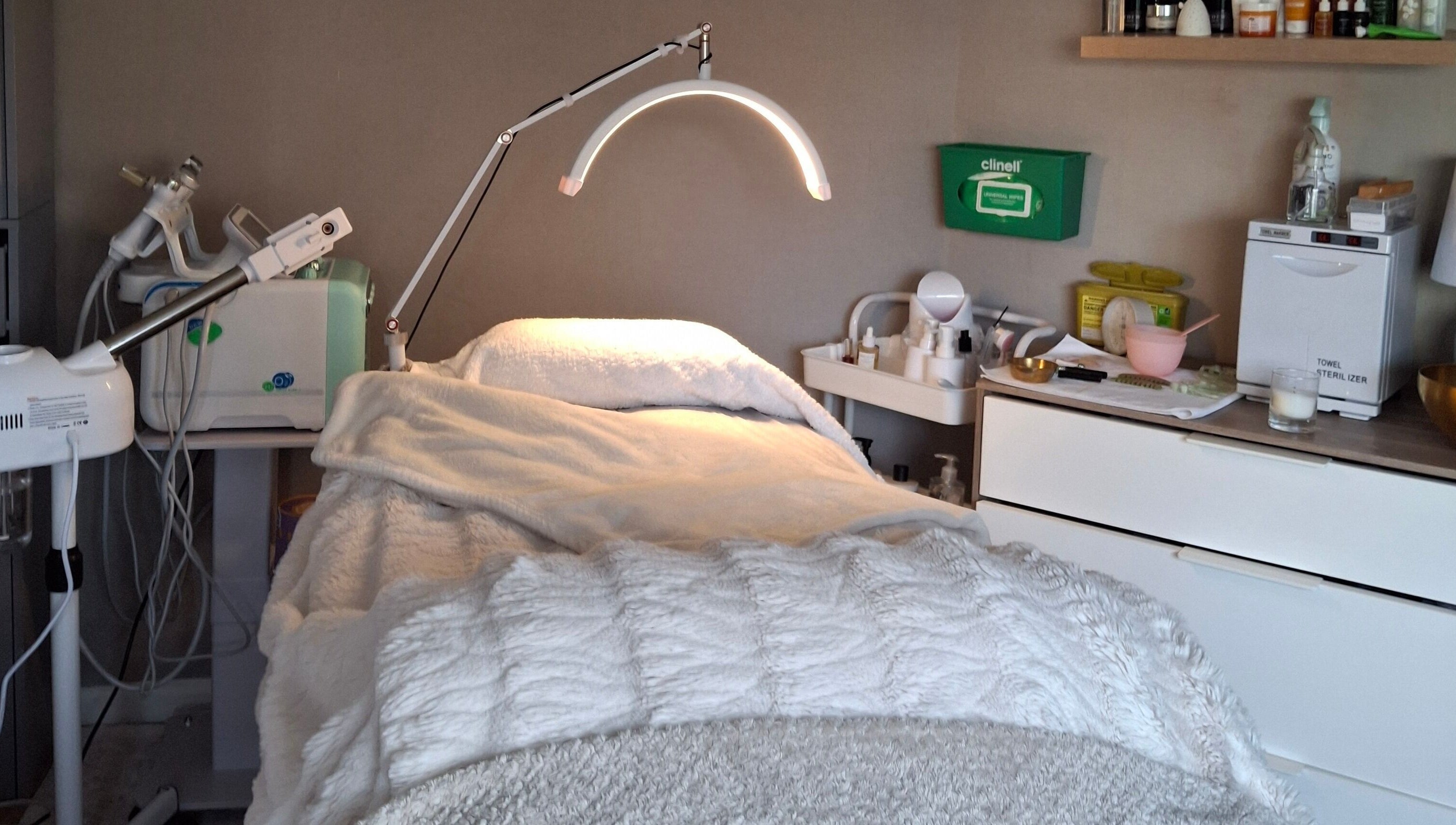 Cozy facial treatment room at Bliss Facials, Llandudno Junction, Wales, GB with modern equipment and relaxing ambiance.
