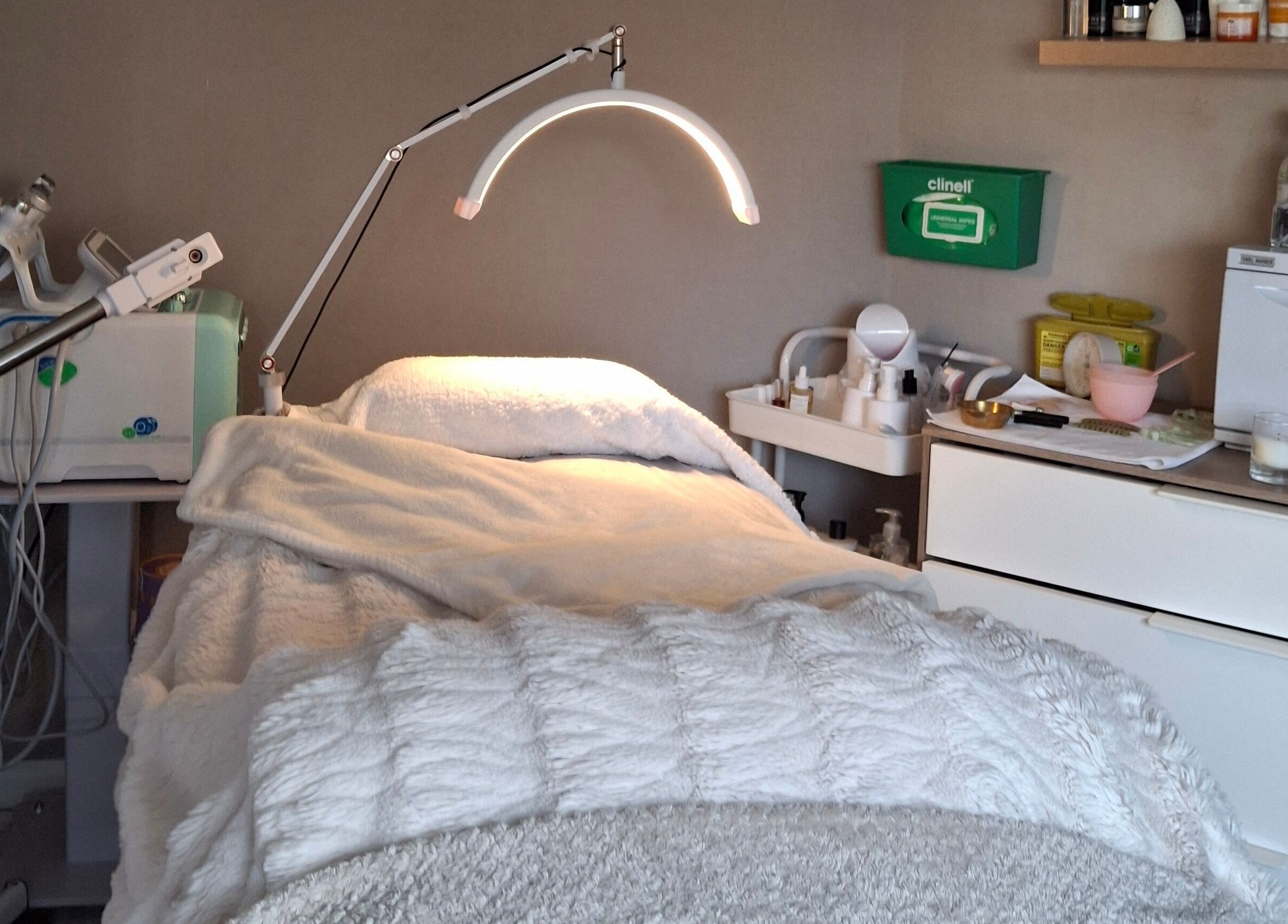 Cozy facial treatment room at Bliss Facials, Llandudno Junction, Wales, GB with modern equipment and relaxing ambiance.