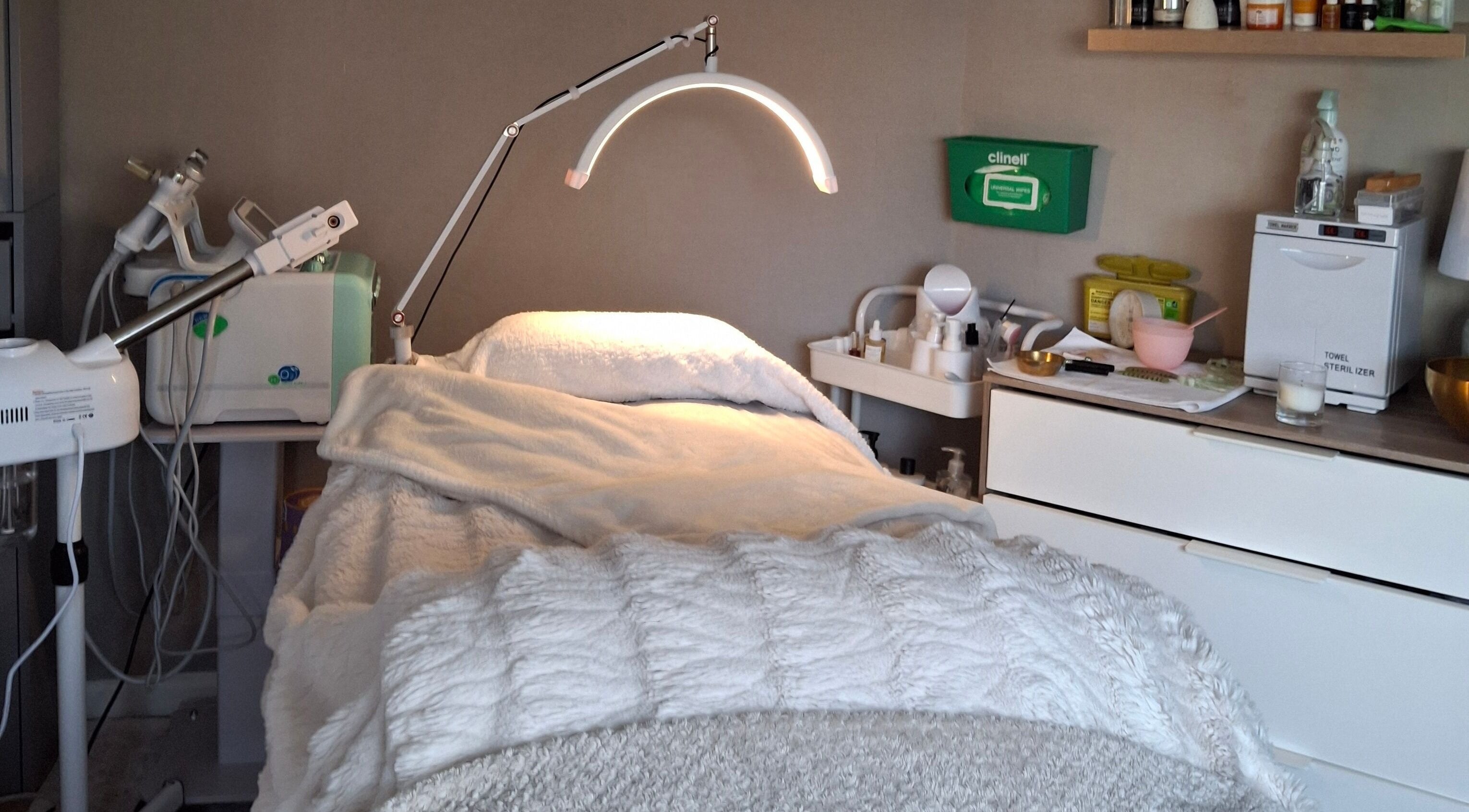 Cozy facial treatment room at Bliss Facials, Llandudno Junction, Wales, GB with modern equipment and relaxing ambiance.