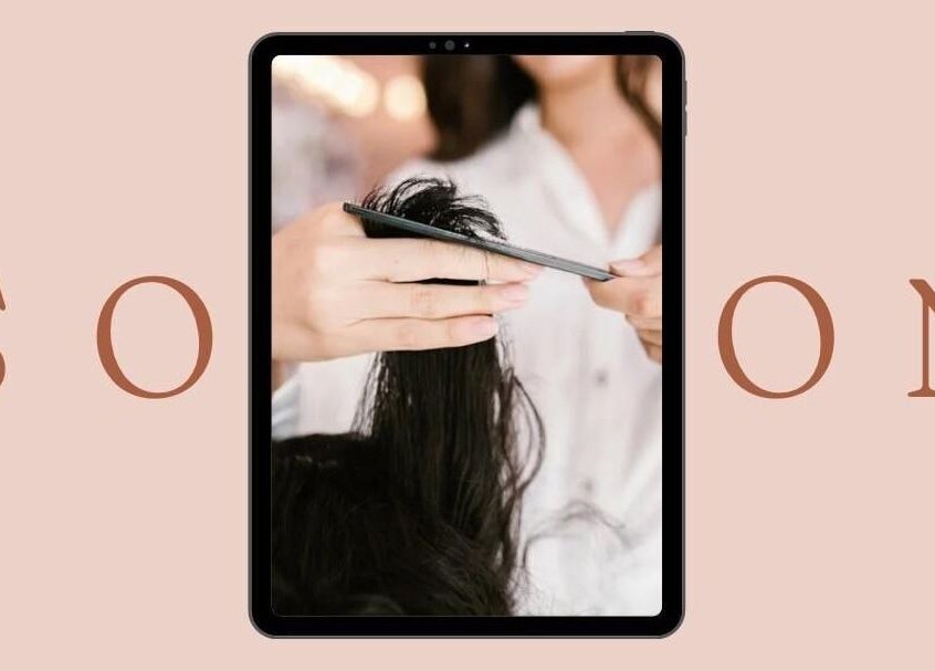 Hair cutting process at Aura Beauty, المبرز, المنطقة الشرقية, SA, showcasing precision and style.