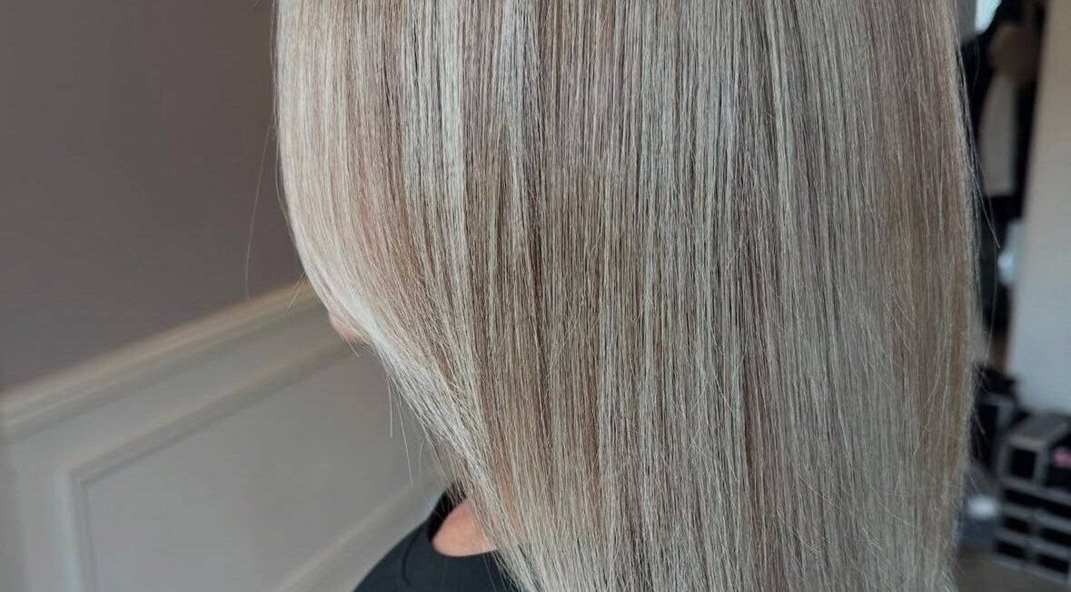 Sleek blonde hairstyle by Mob Hair Mobile Appointments in Giltbrook, England, GB. Perfect for a elegant makeover.