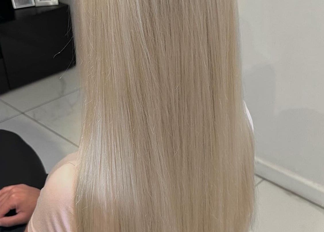 Sleek blonde hair styling by Mob Hair Mobile Appointments in Giltbrook, England, GB, showcasing silky texture.