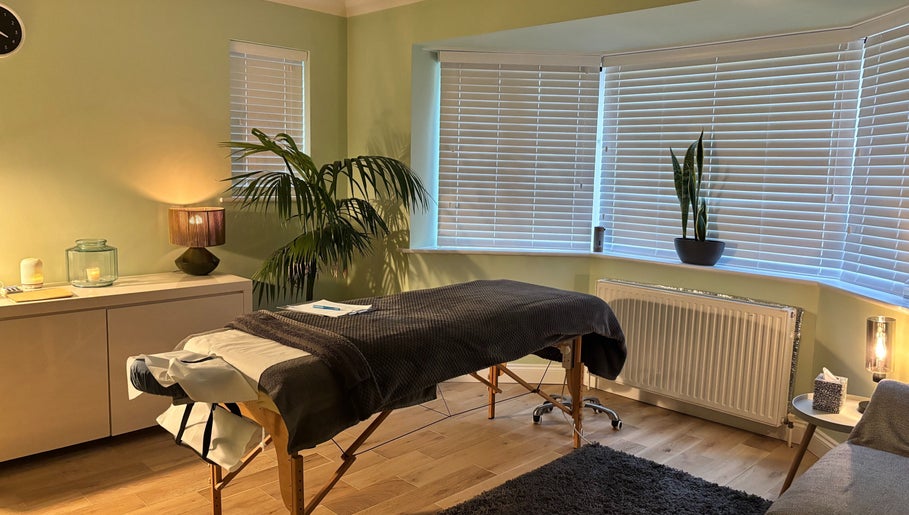 Serenity Therapy - Massage & Wellbeing in Bournemouth offers a peaceful, softly-lit massage room for relaxation.