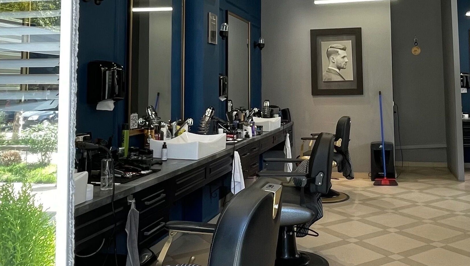 Modern interior of Barber G Shop with stylish chairs in Durrës, Durrës County, AL.