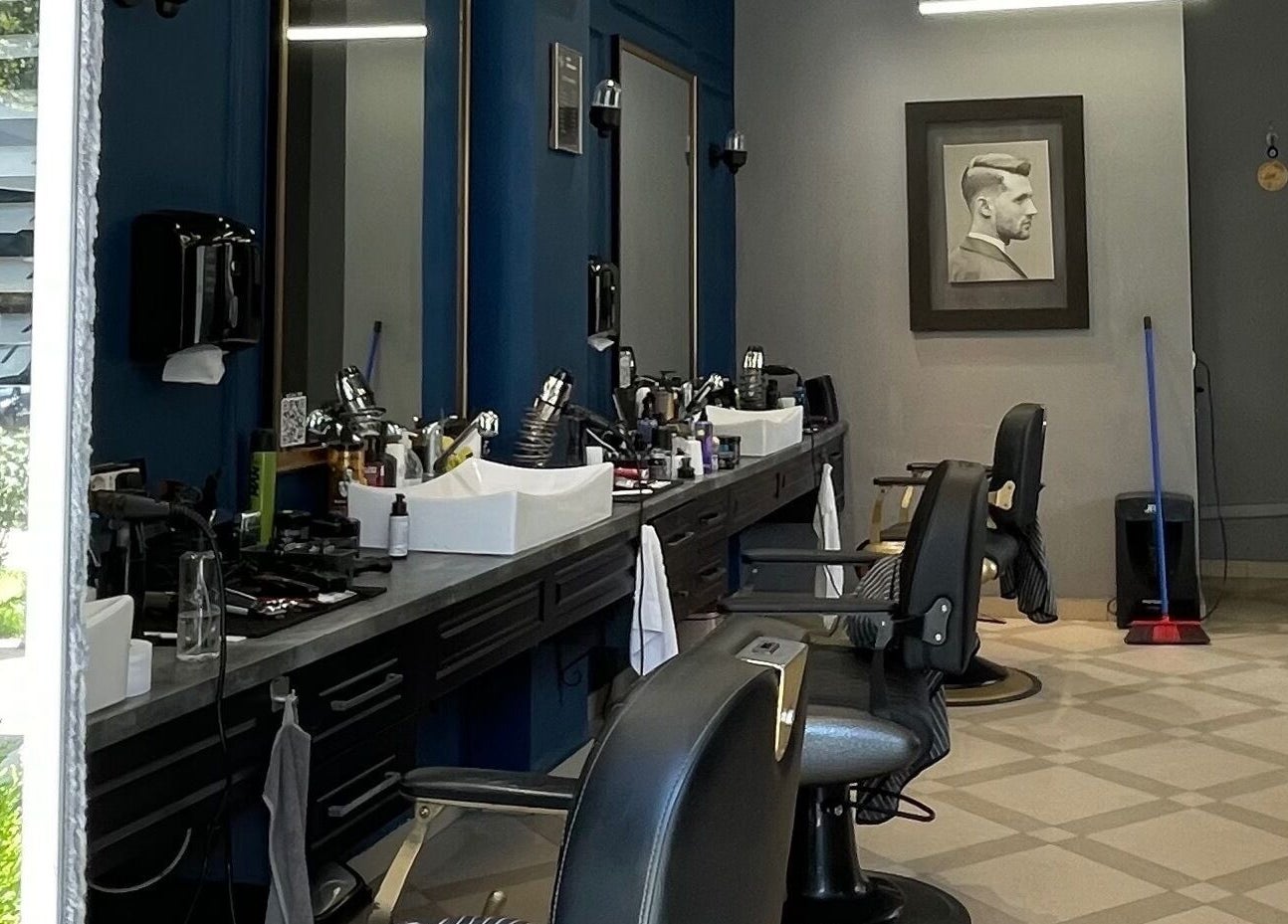 Modern interior of Barber G Shop with stylish chairs in Durrës, Durrës County, AL.
