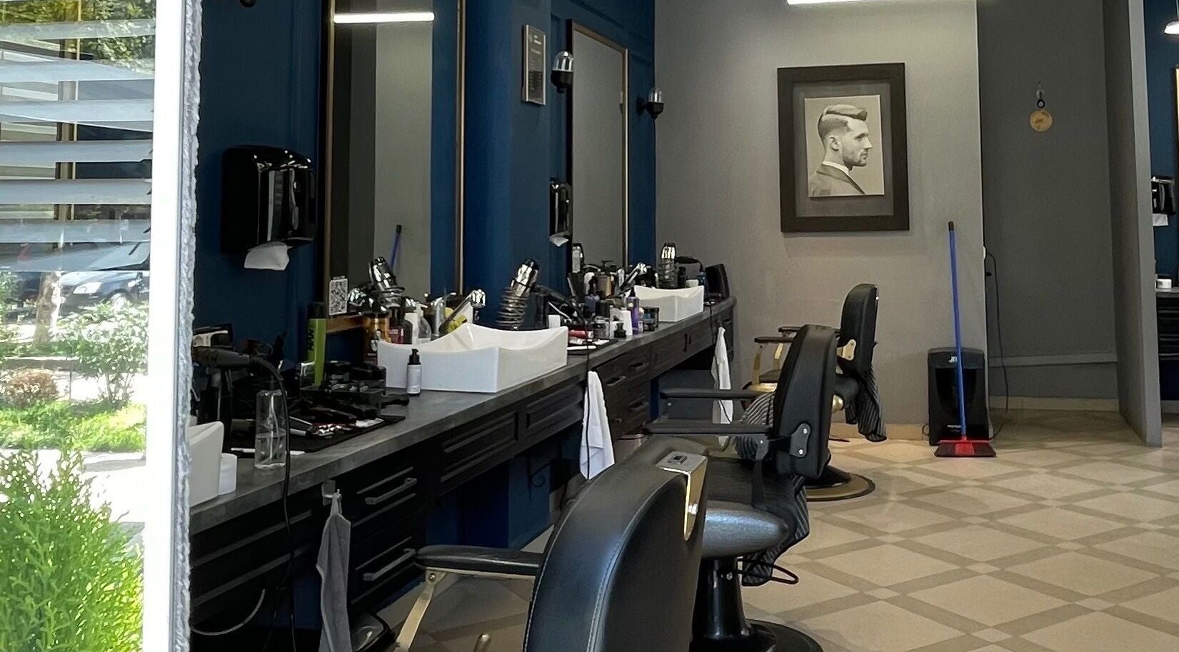 Modern interior of Barber G Shop with stylish chairs in Durrës, Durrës County, AL.