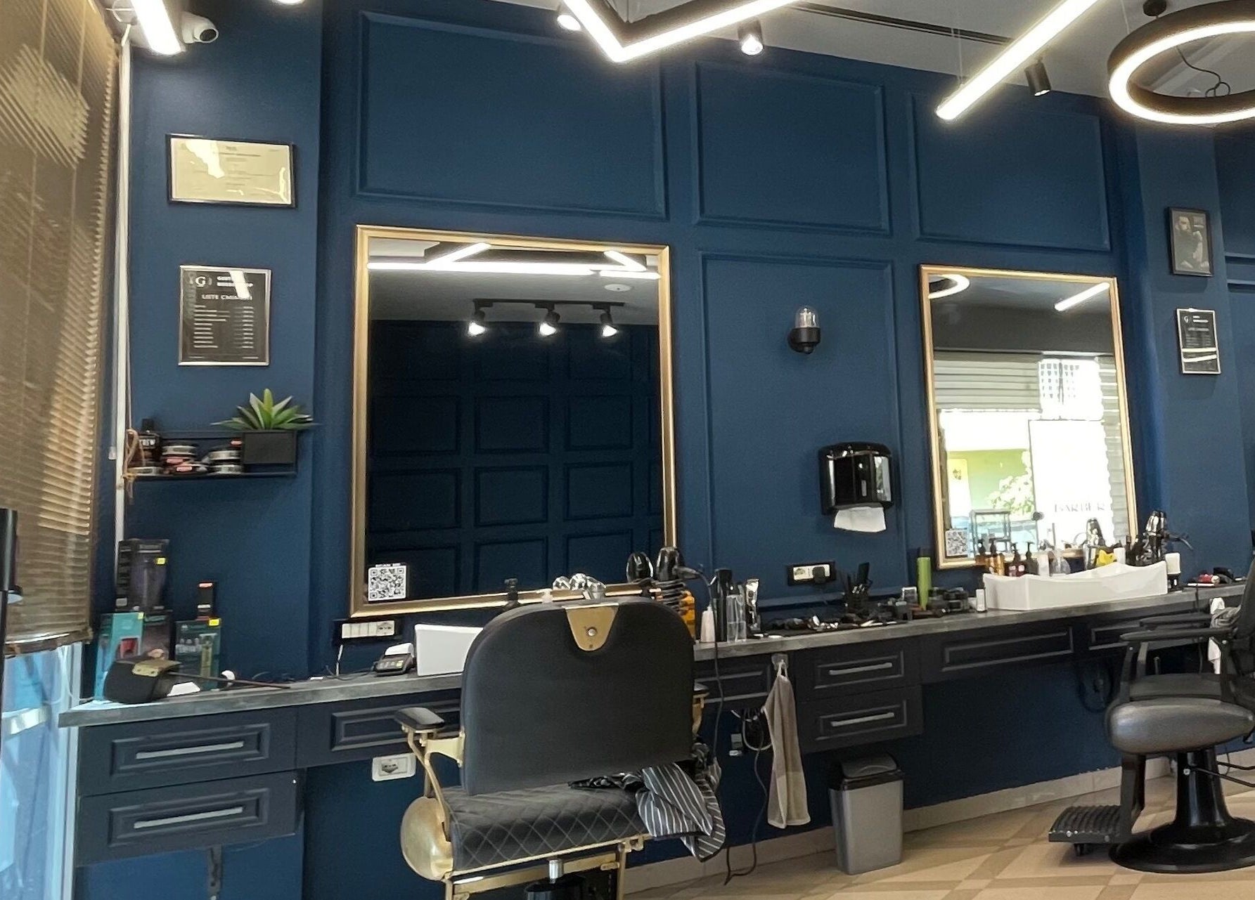 Chic interior of Barber G Shop in Durrës, Durrës County, AL featuring stylish chairs and modern decor.