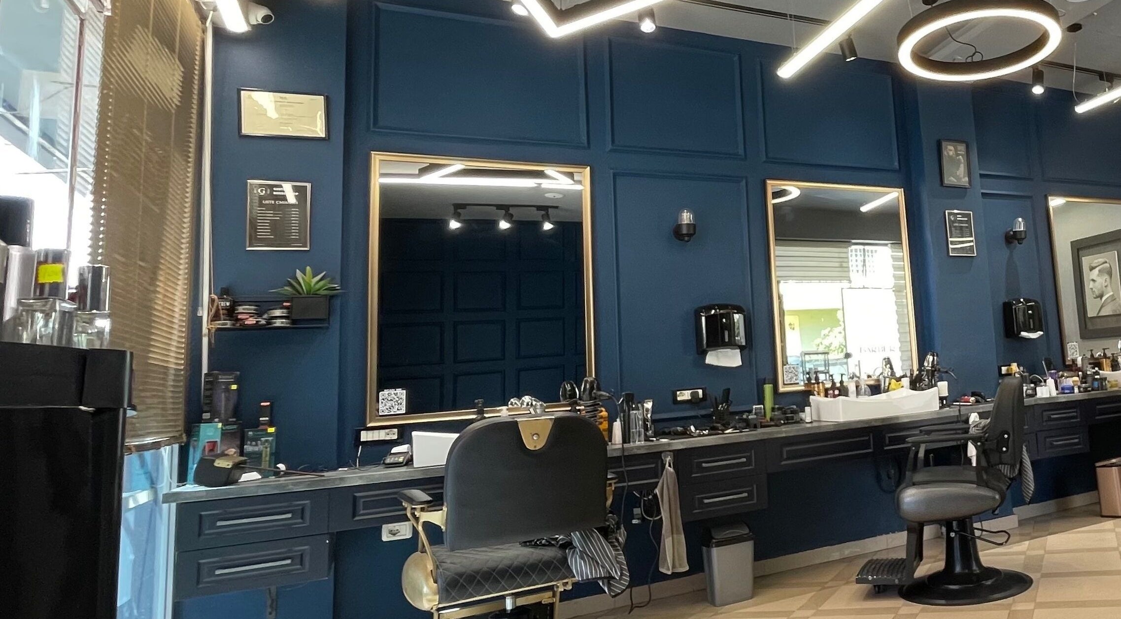 Chic interior of Barber G Shop in Durrës, Durrës County, AL featuring stylish chairs and modern decor.