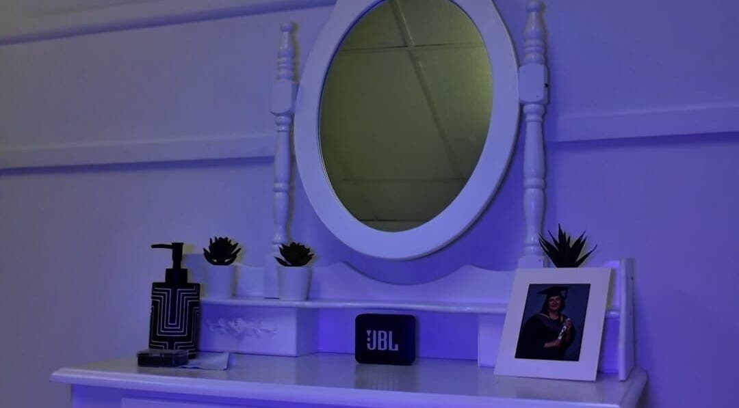 Elegant vanity at Bloom Skin Studio in Burton Upon Trent, England, GB with mirror and decor.