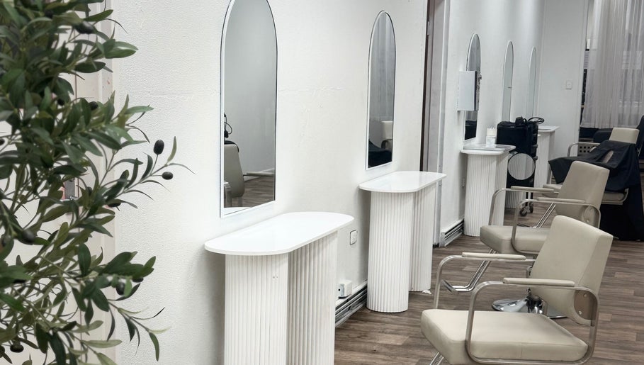 Elegant salon interior at Temple by Zyna, Moranbah, Queensland, AU showcasing modern styling stations.