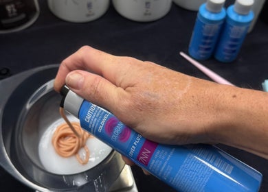 Mixing hair color at Temple by Zyna, Moranbah, Queensland, AU, highlighting expert beauty services.