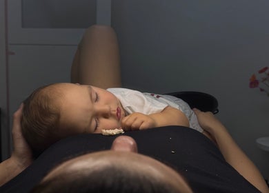 Child peacefully resting at Temple by Zyna, Moranbah, Queensland, AU, showcasing family-friendly ambiance.