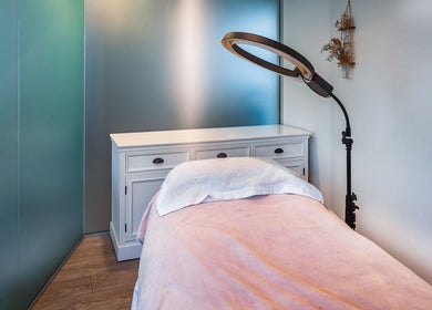 Cozy treatment room at Verdo Beauty Parnell, Auckland, Auckland, NZ, featuring a soft bed and elegant decor.