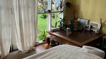 Calming room at Humm Massage, Sawtell/Coffs Harbour, New South Wales, AU with natural light and cozy decor.