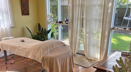 Relaxing massage room at Humm Massage in Sawtell/Coffs Harbour, New South Wales, AU with a tranquil garden view.
