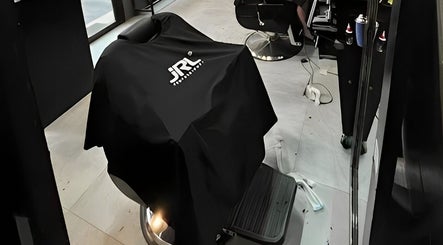 Stylish barber chair at Barbershop AK-15 in Nusa Tenggara Barat, ID, showcasing modern salon interior.