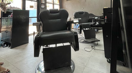 Sleek barber chairs at Barbershop AK-15, Nusa Tenggara Barat, ID, offering top-notch grooming services.